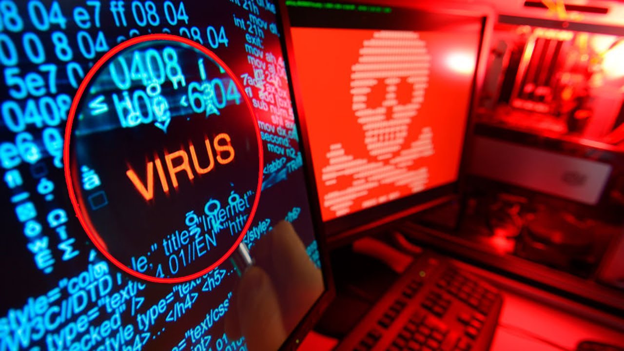 Монітор з червоним підсвічуванням та зображенням черепа (символу небезпеки), де за допомогою лупи виокремлено напис "VIRUS" серед масиву системних даних.